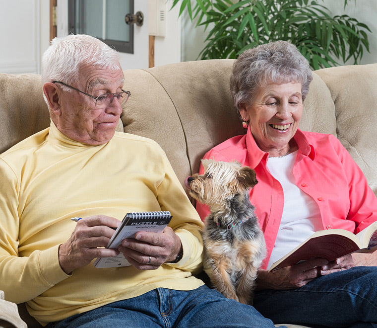 retired couple with their small dog